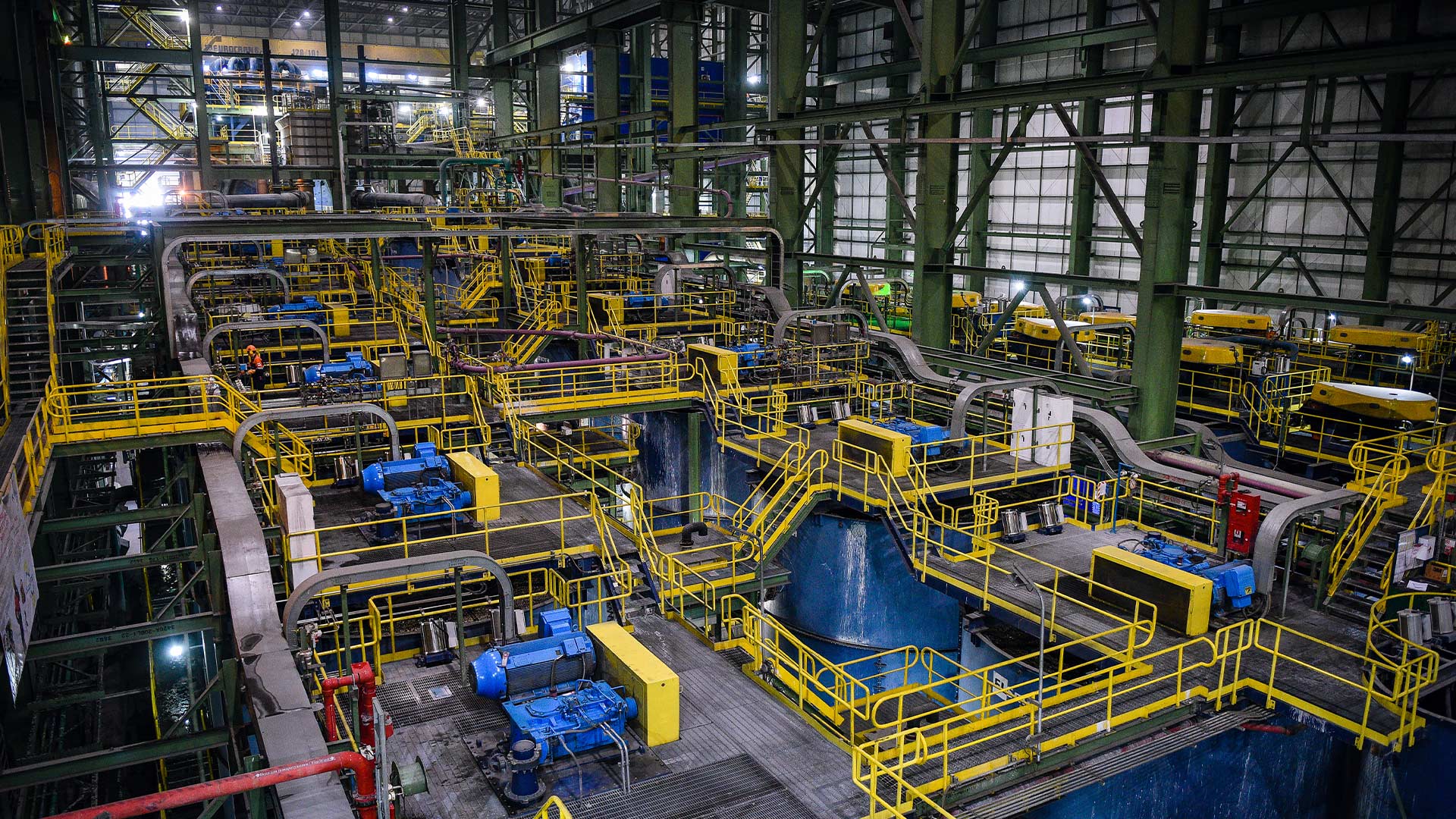 Large warehouse building with yellow railings. 