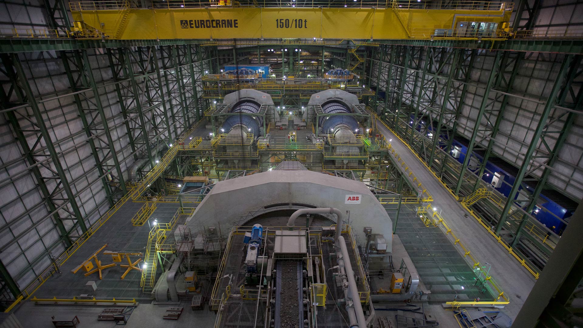 Distant view of indoor multi-level machinery that assists in sulphide operations. 